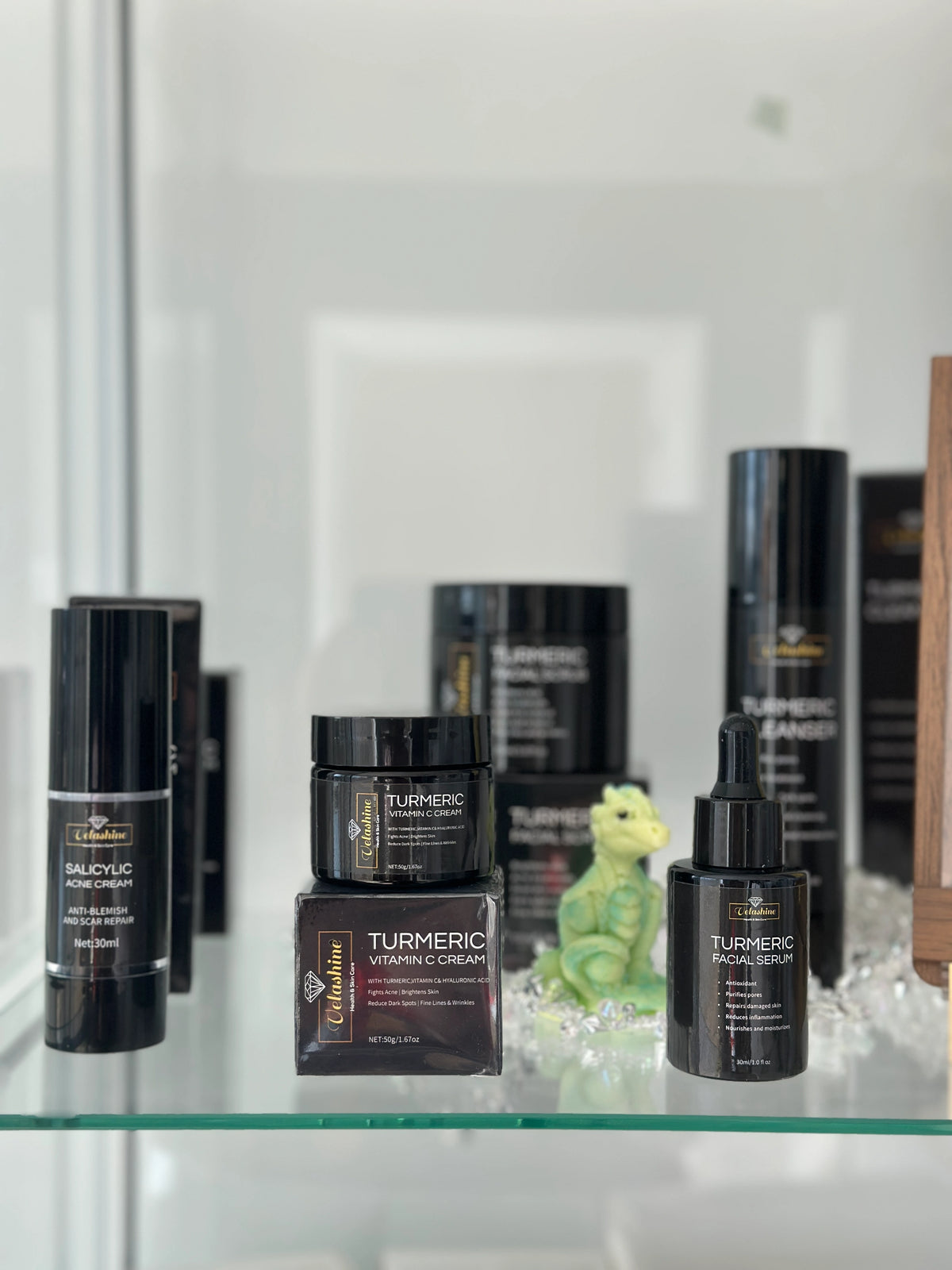 Collection of skincare products on a glass shelf with a blurred background