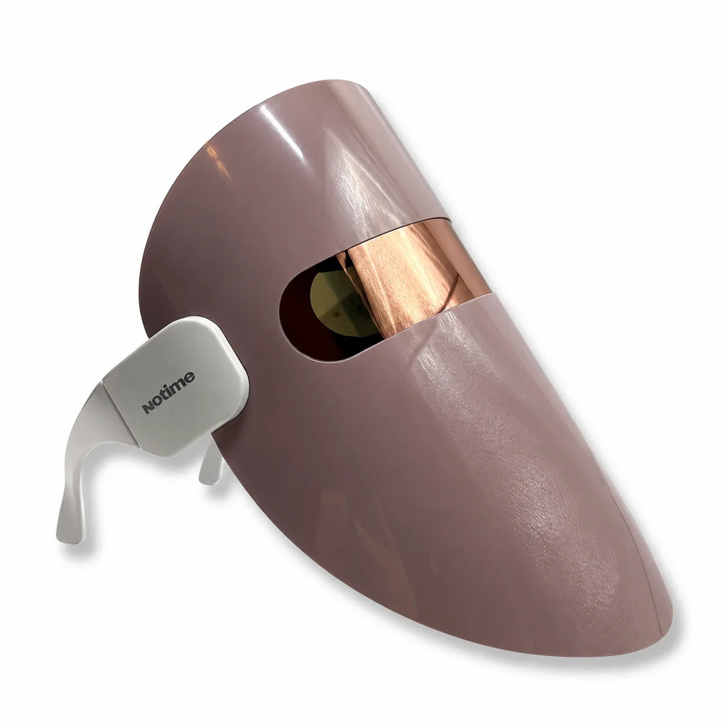 Side view of beige LED light therapy face mask with adjustable head support