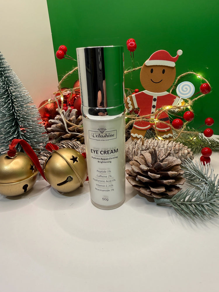 Eye cream bottle with Christmas decorations including a gingerbread man, pine cones, and gold bells.