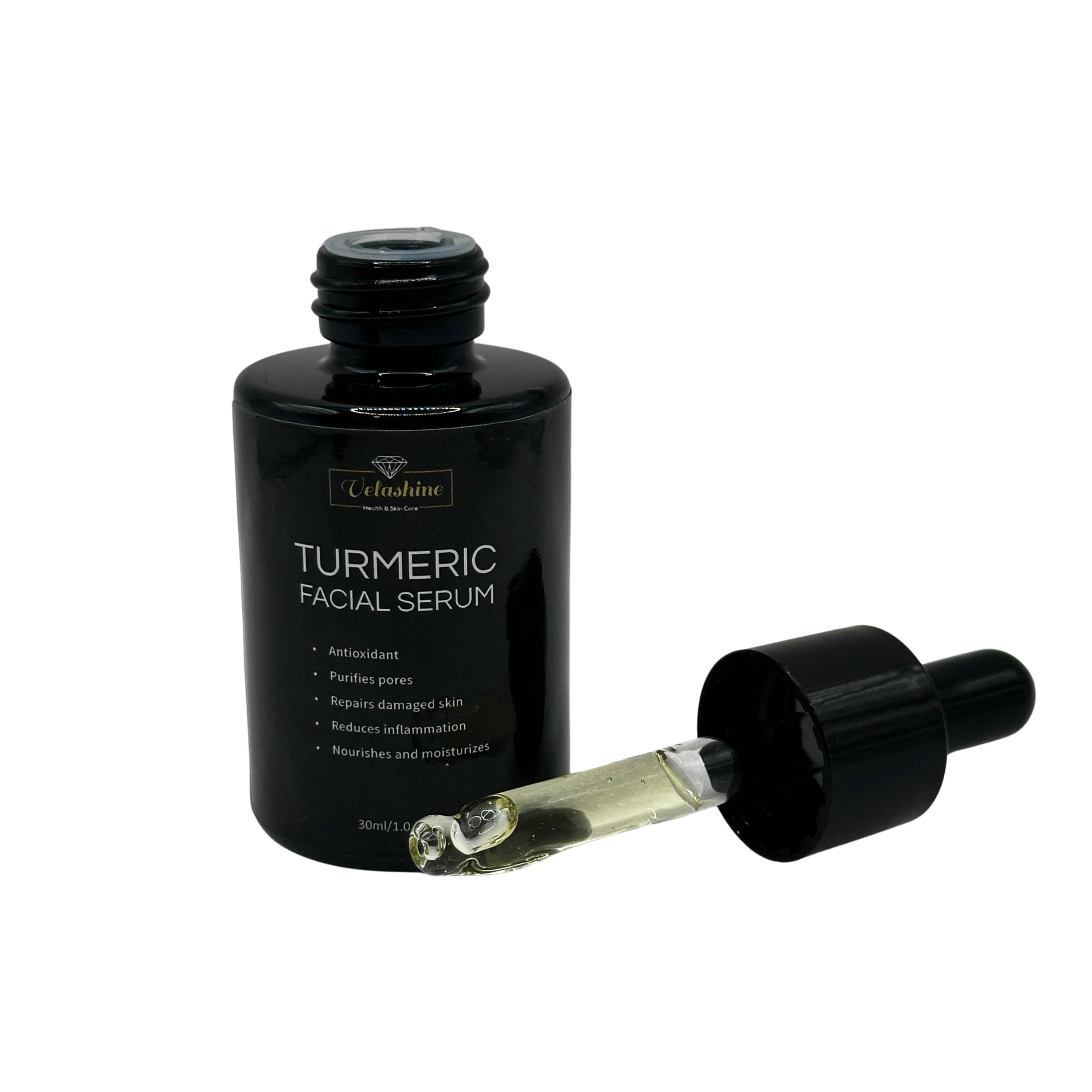Black bottle of turmeric facial serum with dropper on a white background