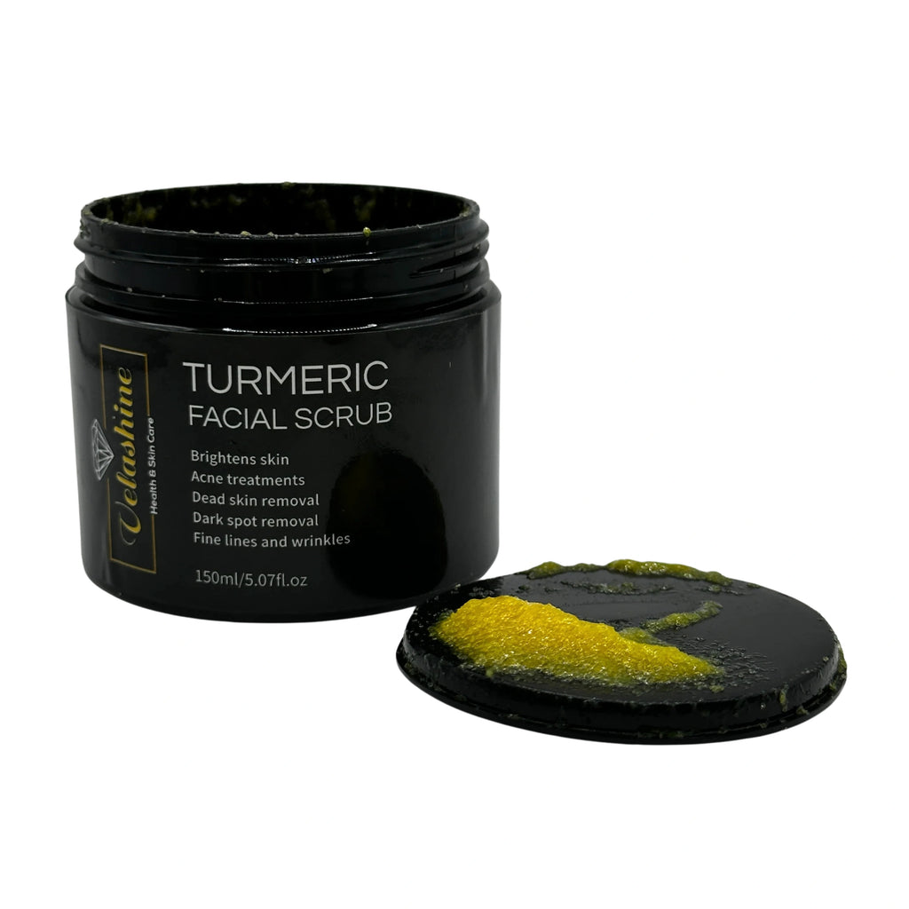 Black jar of turmeric facial scrub with a scoop of scrub visible on a white background